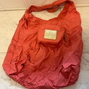 Coach reusable bag that folds into the pocket